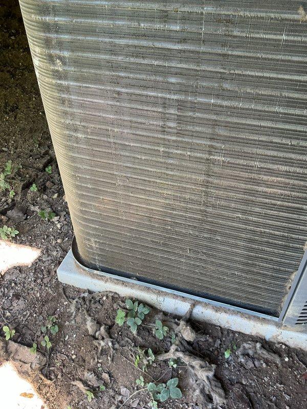 Responded to no-cooling complaint on residential air conditioning system under warranty. Upon inspection, found outdoor condenser unit with heavily soiled coil fins restricting airflow and indoor air handler with severely clogged air filter reducing system capacity. Condenser fan motor operational but unit unable to achieve proper cooling due to restricted airflow at both indoor and outdoor components. Cleaned condenser coil to restore heat transfer efficiency and replaced dirty air filter to restore proper system airflow. Verified system operation with adequate cooling restored and advised homeowner on regular filter maintenance to prevent future performance issues.