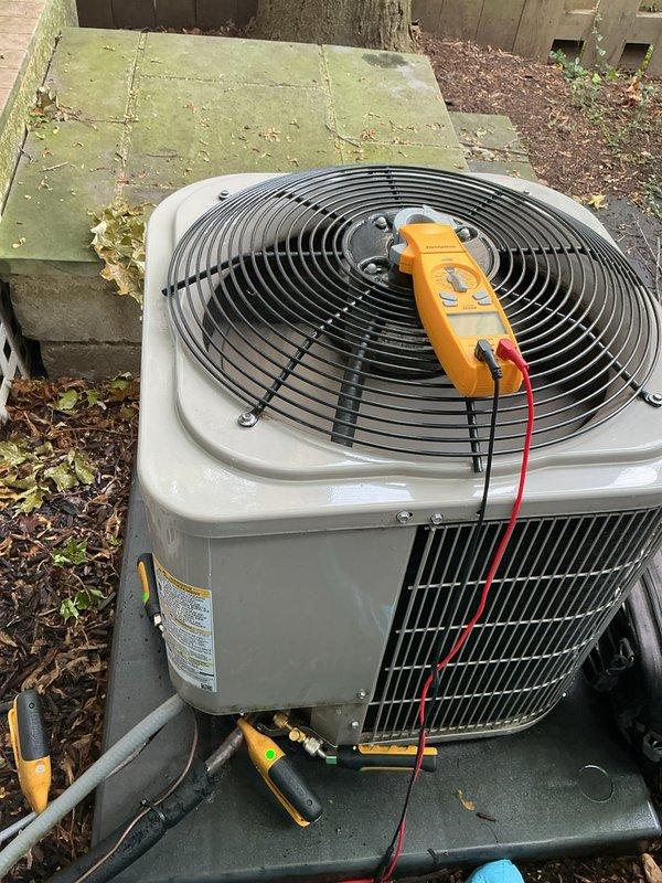Completed preventive maintenance tune-ups on two air conditioning systems. Performed comprehensive diagnostics including electrical testing with digital multimeter, measuring amperage draw at 75.1A on outdoor condenser unit. Inspected refrigerant lines, service valves, and all electrical connections. Both systems operating within normal parameters upon completion of service.