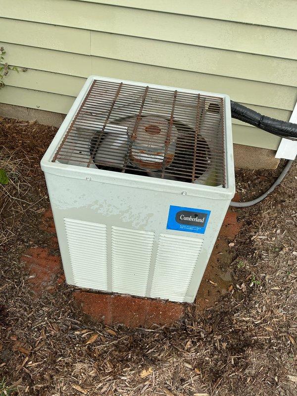 Completed comprehensive air conditioning tune-up and maintenance inspection on Cumberland brand outdoor condensing unit. Performed standard preventive maintenance procedures including visual inspection of cabinet exterior, refrigerant lines, and fan grille assembly, noting weathering and minor rust present on top grille but unit operational. System assessed and serviced per manufacturer specifications for optimal cooling season performance.