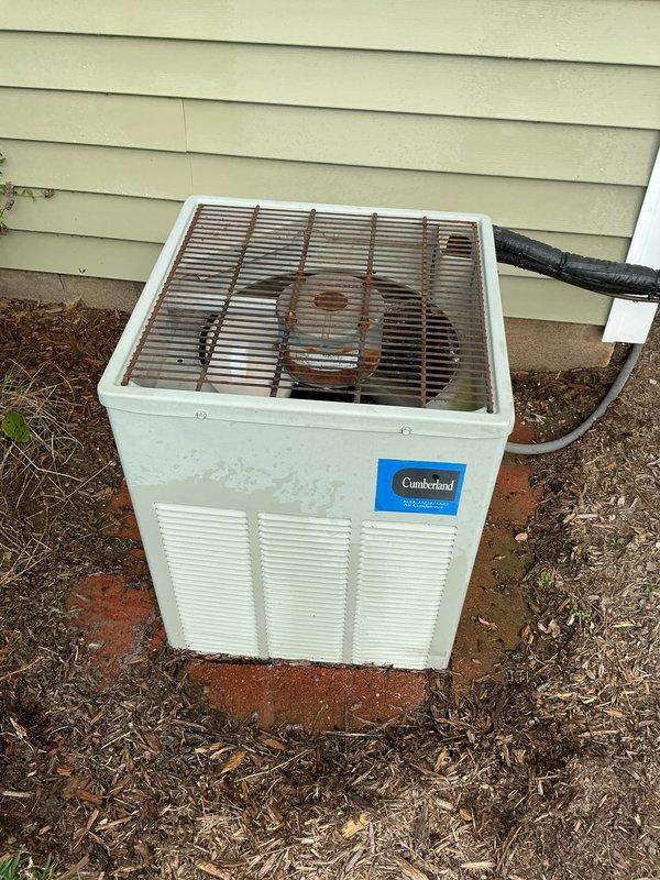 Completed comprehensive air conditioning tune-up and maintenance inspection on Cumberland brand outdoor condensing unit. Performed standard preventive maintenance procedures including visual inspection of cabinet exterior, refrigerant lines, and fan grille assembly, noting weathering and minor rust present on top grille but unit operational. System assessed and serviced per manufacturer specifications for optimal cooling season performance.