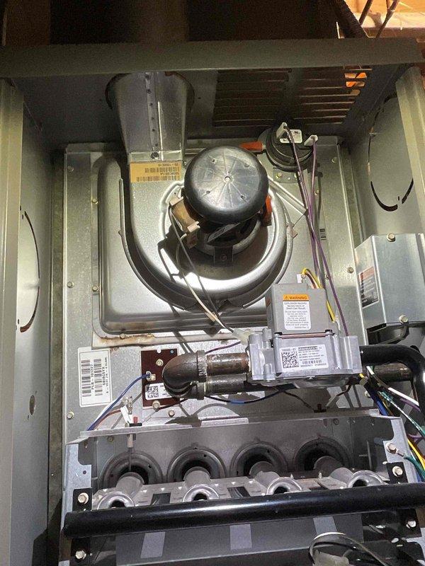 Performed scheduled heating maintenance on residential furnace unit. Conducted comprehensive inspection of blower motor assembly, heat exchanger, burner manifold, and all electrical connections. Verified proper operation of all system components including motor, wiring harnesses, and control modules. Inspected heat exchanger for cracks or deterioration, confirmed burner ports are clear and unobstructed. Checked all electrical connections for signs of wear or overheating. System tested and found operating within normal parameters. Customer approved membership renewal at time of service.