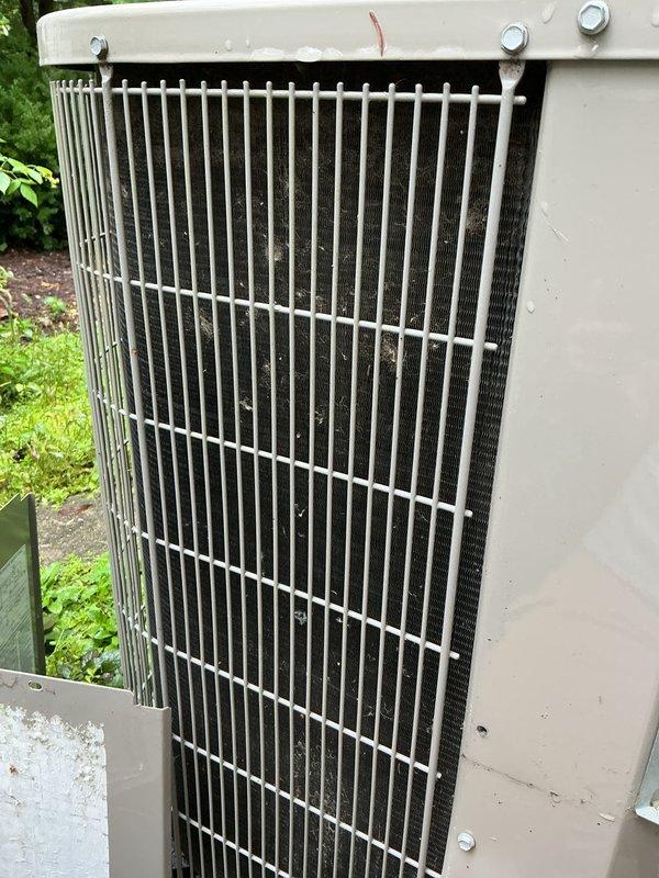 Completed comprehensive AC tune-up on outdoor condensing unit, including inspection of condenser coils which showed accumulated debris and dust between fins requiring attention. Performed standard maintenance procedures, verified fan operation, checked refrigerant levels, and ensured unit was operating within manufacturer specifications for optimal cooling performance.