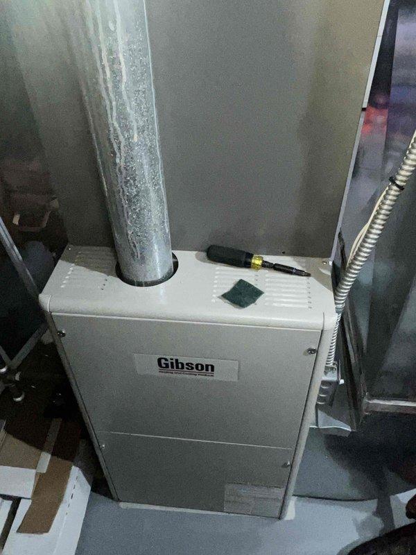 Completed comprehensive tune-up on 11-year-old Gibson gas furnace and water heater. During inspection, identified significant frost accumulation on supply plenum and ductwork indicating excessive condensation due to inadequate insulation or airflow restriction. Performed standard maintenance protocol including filter replacement, burner inspection and cleaning, flame sensor cleaning, blower motor lubrication, and combustion analysis. Verified proper furnace operation with temperature rise within manufacturer specifications. Inspected heat exchanger for cracks or deterioration with no issues found. Checked and adjusted gas pressure, confirmed proper ignition sequence, and tested all safety controls including limit switches and rollout sensors. Evaluated venting system for proper draft and clearances. 

Addressed condensation issue on supply duct by inspecting for airflow restrictions and verifying proper system operation. Recommended monitoring ductwork for continued moisture accumulati