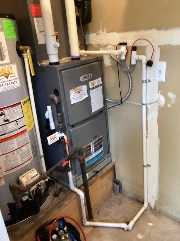 Completed comprehensive tune-up on Lennox gas furnace and air conditioning system at residential property. Performed full system inspection including visual examination of all components, electrical connections, gas line integrity, and condensate drainage system. Verified proper operation of both heating and cooling equipment, checked refrigerant levels using manifold gauges, and confirmed all safety controls functioning correctly. All equipment operating within manufacturer specifications at time of service.