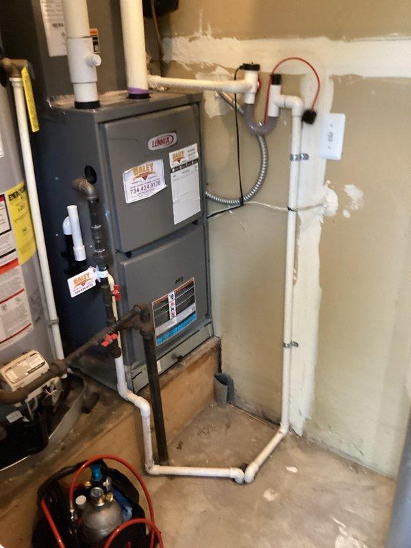 Completed comprehensive tune-up on Lennox gas furnace and air conditioning system at residential property. Performed full system inspection including visual examination of all components, electrical connections, gas line integrity, and condensate drainage system. Verified proper operation of both heating and cooling equipment, checked refrigerant levels using manifold gauges, and confirmed all safety controls functioning correctly. All equipment operating within manufacturer specifications at time of service.