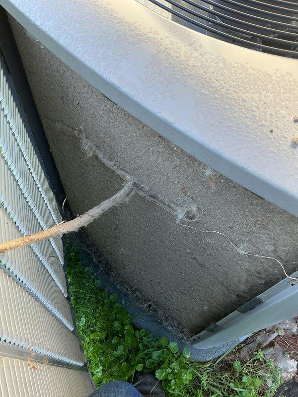 Completed scheduled air conditioning tune-up on dual outdoor HVAC system consisting of condenser unit and heat pump. Performed comprehensive maintenance inspection, cleaned condenser coils which showed accumulation of dirt and debris, checked refrigerant levels, tested electrical connections, and verified proper operation of both units. Noted concrete equipment pad showing significant cracking and deterioration with vegetation growth around units; recommended monitoring for future replacement to ensure proper equipment support and drainage.
