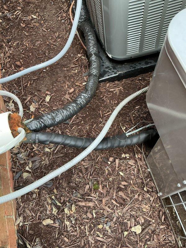 Responded to service call to address multiple concerns with residential HVAC system. Inspected outdoor condenser units and found refrigerant line insulation deteriorated and requiring replacement. Examined humidifier system and discovered disconnected water line, reconnected supply line to restore proper operation. Evaluated condenser fan operation on both units and confirmed proper function. Assessed refrigerant line covering and insulation condition, documented areas needing repair or replacement to prevent energy loss and line sweating.