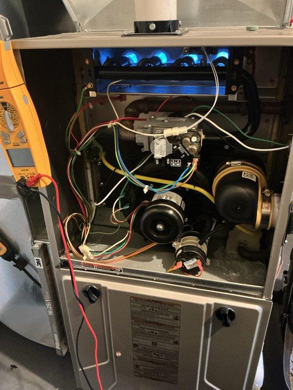Performed comprehensive furnace tune-up and safety inspection on gas-fired heating unit. Conducted operational testing with burner assembly firing properly, verified combustion chamber integrity, and performed electrical diagnostics using digital multimeter to measure voltage and system performance parameters. Inspected blower motor assembly, pressure switches, and all electrical connections throughout the unit, confirming all components operating within manufacturer specifications.