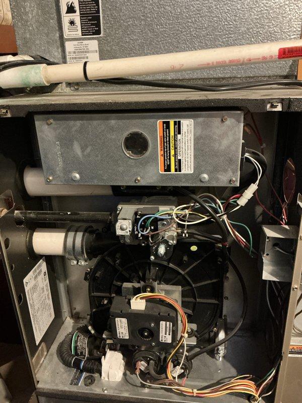 Completed comprehensive tune-up on 15-year-old furnace located in basement with no reported operational issues. Performed full system inspection including blower motor assembly, electrical connections, control boards, and all internal components. Verified proper operation of all mechanical and electrical systems, checked wiring harnesses and connections throughout unit, inspected condensate drain lines, and confirmed all safety labels and warnings were intact and legible. System tested and found operating within normal parameters.