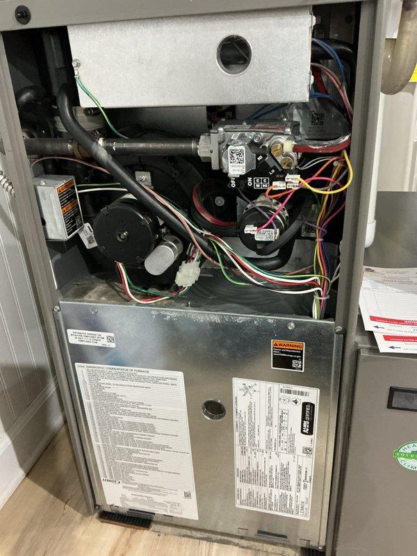 Performed scheduled preventive maintenance on two residential furnace units. Conducted comprehensive inspection of all internal components including blower motor assemblies, control boards, gas valves, electrical connections, and safety systems. Verified proper operation of all colored wire connections, checked control modules and QR-coded components for functionality, and inspected flexible ducting and pipe fittings. Confirmed thermal insulation integrity, reviewed manufacturer specifications on unit labels, and ensured all safety warnings and informational plates were legible and intact. Both furnace systems tested and operating within normal parameters upon completion of maintenance service.