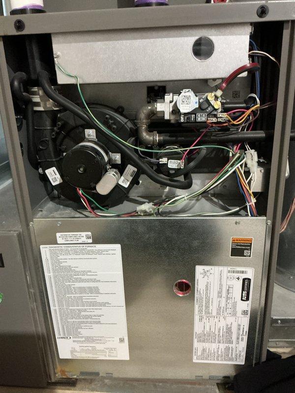 Performed scheduled preventive maintenance on two residential furnace units. Conducted comprehensive inspection of all internal components including blower motor assemblies, control boards, gas valves, electrical connections, and safety systems. Verified proper operation of all colored wire connections, checked control modules and QR-coded components for functionality, and inspected flexible ducting and pipe fittings. Confirmed thermal insulation integrity, reviewed manufacturer specifications on unit labels, and ensured all safety warnings and informational plates were legible and intact. Both furnace systems tested and operating within normal parameters upon completion of maintenance service.