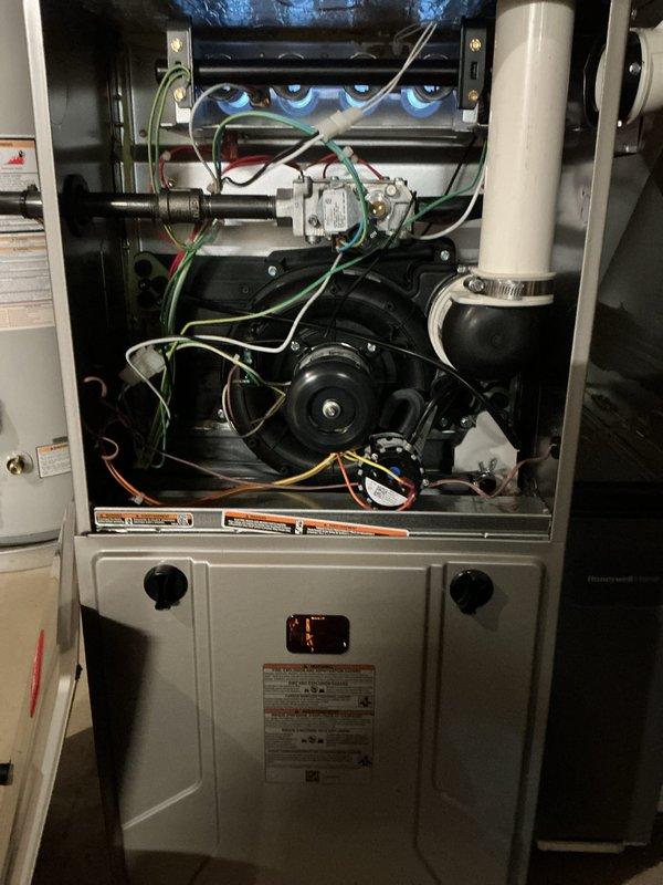 Completed scheduled preventative maintenance on residential Bryant air conditioning system and gas furnace. Performed comprehensive tune-up including inspection of burner assembly operation with visual confirmation of proper flame characteristics, tested all electrical connections and components, verified proper operation of induced draft blower motor and gas valve assembly, and inspected condensate drainage system. Exterior condenser unit inspected for proper airflow, fan motor operation verified, refrigerant lines checked for secure mounting and insulation integrity, and unit found to be operating within normal parameters with no immediate repairs required.