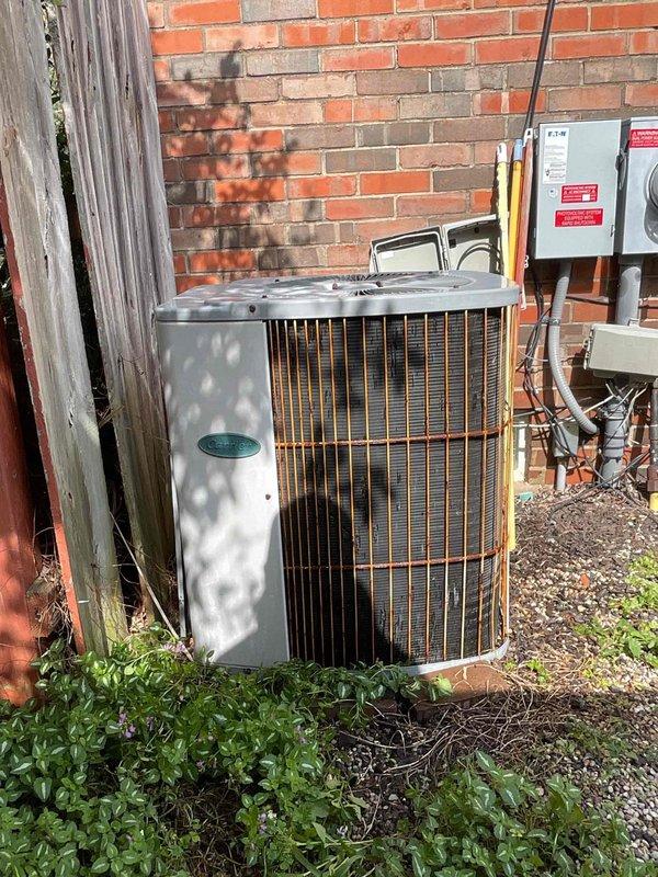 Completed scheduled preventive maintenance tune-up on residential cylindrical air conditioning condenser unit. Performed comprehensive system inspection, verified proper operation of all components, checked refrigerant lines and electrical connections at disconnect box, and documented equipment condition with photos showing unit in satisfactory operating condition with normal weathering for outdoor installation.