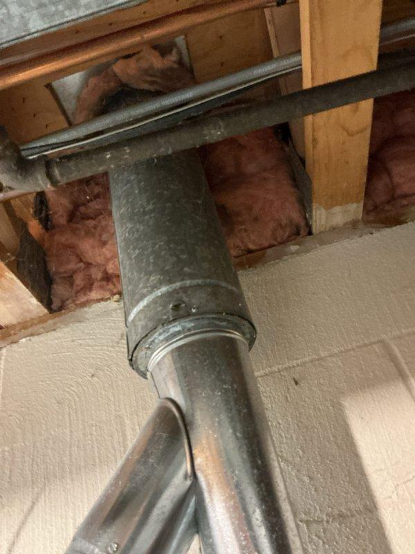 # HVAC Installation Completed

Successfully installed a new Bryant gas furnace system in residential basement location. The installation included proper positioning and mounting of the furnace unit on concrete flooring, connection of supply and return ductwork with appropriate transitions and elbows, and integration with existing HVAC infrastructure. All galvanized metal ductwork was routed through ceiling joists and properly secured to wooden framing members. The system was installed in accordance with manufacturer specifications and local building codes. All electrical connections, gas line hookups, and venting components were completed and tested for proper operation. The furnace was commissioned and verified to be functioning at optimal performance levels.