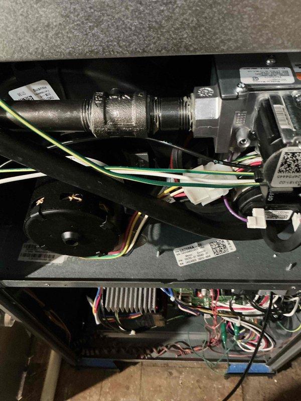 Completed comprehensive tune-up and maintenance inspection on both air conditioning and gas furnace systems as part of the second scheduled visit included with recent equipment installation. Performed thorough examination of furnace internal components including gas valve assembly, burner connections, and control board with heat sink; verified all electrical connections and wire harnesses were secure. Inspected outdoor AC unit and noted filter accumulation requiring attention to maintain optimal airflow and system efficiency.