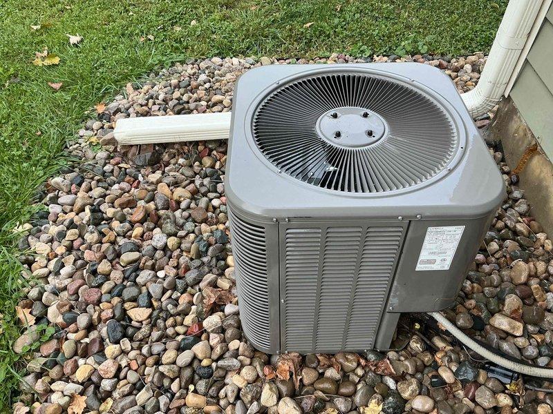 Completed scheduled air conditioning tune-up and preventative maintenance on residential condensing unit. Performed comprehensive system inspection, verified proper operation of all components, and documented equipment condition with photographs showing unit in fair working order with normal weathering on exterior surfaces.