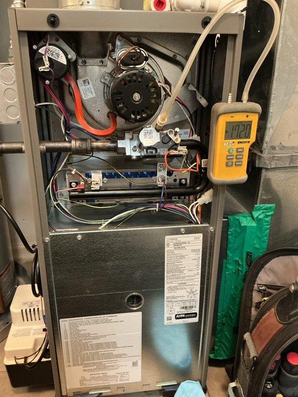 Completed annual maintenance tune-up on 3-year-old Lennox furnace. Performed comprehensive system inspection including blower motor operation, gas valve assembly, ignition control module, and flame sensor verification. Conducted diagnostic testing with multimeter and manometer readings to verify proper system pressures and electrical connections. All components found in good working condition with normal operational wear. System operating properly with no deficiencies noted.
