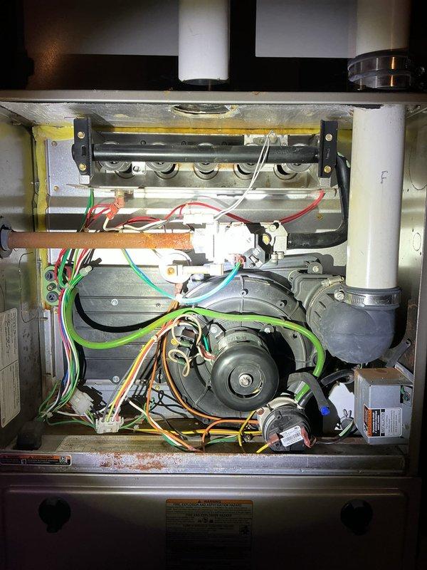 Responded to no-heat call for gas furnace in farmhouse. Upon arrival, performed diagnostic inspection of unit with access panels removed to assess internal components including burner assembly, gas valve manifold, blower motor, electrical connections, and control board. Inspected gas valve, burner ports, ignition system, and all associated wiring for proper operation. Verified blower motor assembly, condensate drainage system, and venting components for functionality. Completed necessary repairs to restore heat operation to the unit.