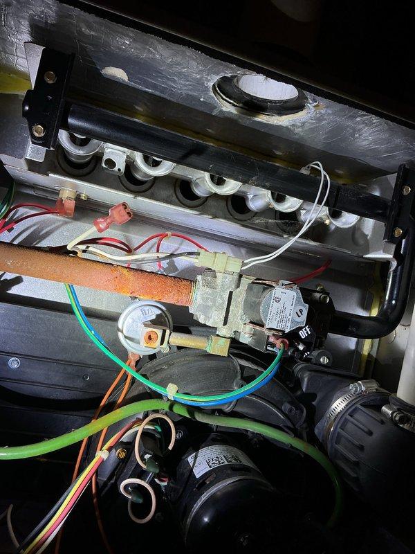 Responded to no-heat call for gas furnace in farmhouse. Upon arrival, performed diagnostic inspection of unit with access panels removed to assess internal components including burner assembly, gas valve manifold, blower motor, electrical connections, and control board. Inspected gas valve, burner ports, ignition system, and all associated wiring for proper operation. Verified blower motor assembly, condensate drainage system, and venting components for functionality. Completed necessary repairs to restore heat operation to the unit.
