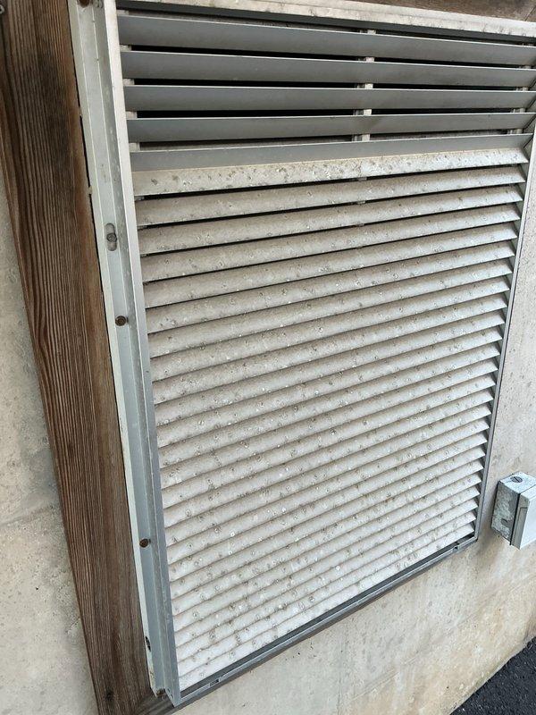 Completed comprehensive AC tune-up and system inspection on residential HVAC unit. Performed routine maintenance including inspection of interior return air grille and exterior ventilation intake unit, noting dust accumulation on filter media and louvers consistent with normal operation. All system components evaluated and found operational within manufacturer specifications.