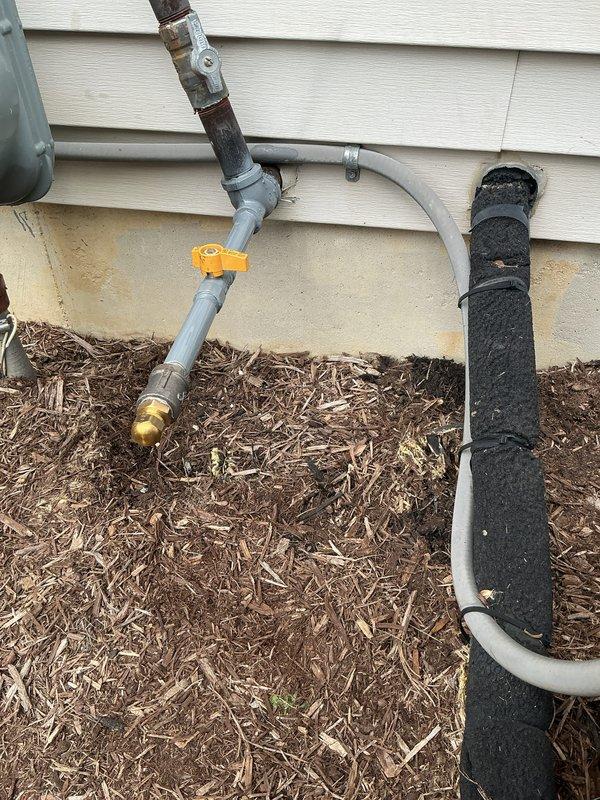Installed tee fitting on existing natural gas line to provide dedicated fuel supply for portable generator. Work included routing black iron pipe from gas meter, installing appropriate shut-off valve with orange handle for easy identification, and pressure testing all connections to ensure leak-free operation per code requirements.