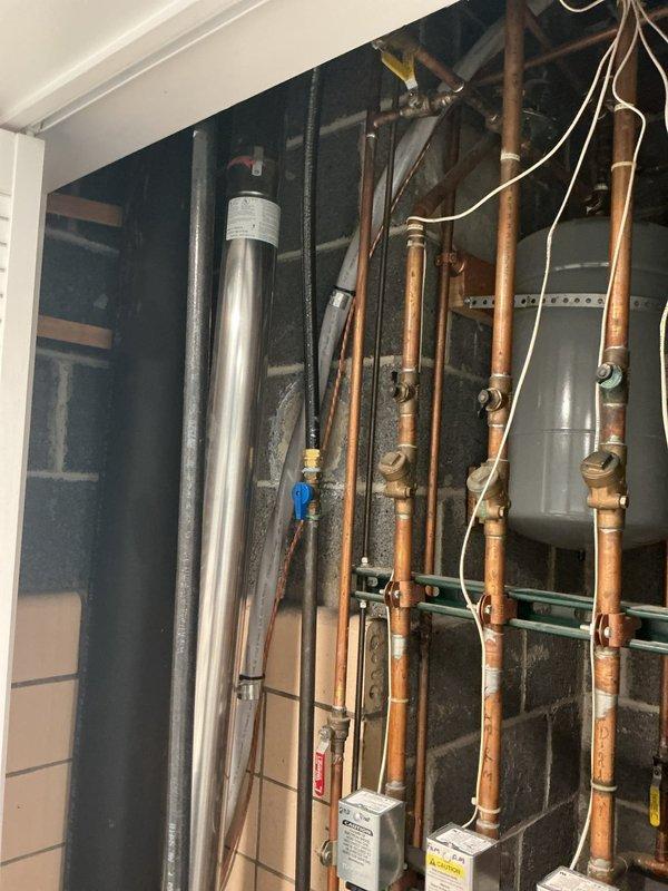 Responded to service call for boiler not heating properly. Upon arrival, performed comprehensive system inspection of the exposed hydronic heating system, including multiple zone valves, expansion tanks, copper piping network, and associated controls. Diagnosed heating issue, completed necessary repairs to restore proper operation, and verified system functionality. All components tested and confirmed operational before departure.