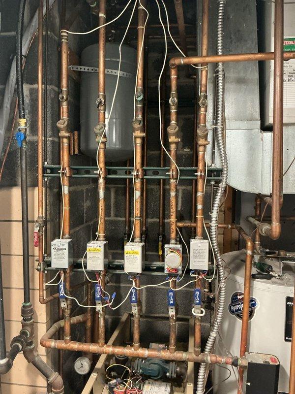 Responded to service call for boiler not heating properly. Upon arrival, performed comprehensive system inspection of the exposed hydronic heating system, including multiple zone valves, expansion tanks, copper piping network, and associated controls. Diagnosed heating issue, completed necessary repairs to restore proper operation, and verified system functionality. All components tested and confirmed operational before departure.