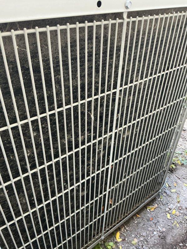 Completed scheduled AC tune-up and preventative maintenance on Bryant residential condensing unit. Upon arrival, observed heavy accumulation of dirt, dust, and debris on condenser coils and fins, along with organic matter including leaves and twigs around the unit base. Performed comprehensive system inspection, cleaned condenser coils, removed debris from surrounding area, checked refrigerant levels, tested electrical connections, verified proper fan operation, and confirmed unit returned to optimal cooling performance. System operating within normal parameters upon completion.
