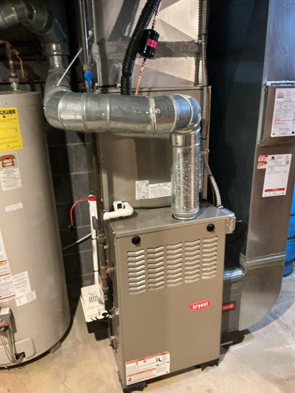Completed installation of new air conditioning system and evaporator coil at residential property. The new A/C unit was professionally installed and connected to existing Bryant furnace system, with all ductwork, refrigerant lines, condensate drainage, and electrical connections properly configured and tested to ensure optimal system performance and efficiency.