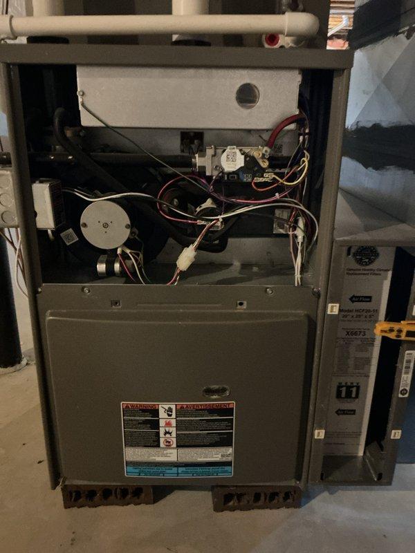 Performed comprehensive tune-up maintenance on 2-year-old Lennox furnace system. Accessed internal components, inspected blower motor assembly, electrical connections, gas valve, and control boards for proper operation. Addressed thermostat calibration concern reported as 5-degree temperature differential; verified thermostat accuracy and adjusted settings to ensure proper system cycling and temperature control.