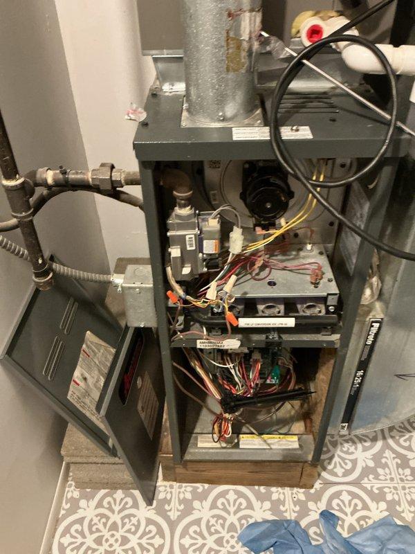 Completed comprehensive multi-system tune-up service including air conditioning unit, gas furnace, and hot water heater maintenance. Performed thorough inspection of furnace components with access panel removed, checking blower motor operation, electrical connections, control board functionality, and gas line connections. All systems tested and found operating within normal parameters, with internal components cleaned and inspected per manufacturer specifications.