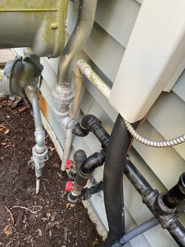 Completed full HVAC system installation including new air handler in attic space, outdoor condensing unit, evaporator coil, and water heater. Air handler was positioned in attic with proper clearances and secured to structural framing, with refrigerant lines and condensate drain properly installed. Exterior condensing unit was mounted on building exterior with appropriate electrical disconnect and refrigerant line connections. Water heater installation included proper venting, gas connections, and safety controls. All refrigerant lines were insulated and secured, ductwork connections were sealed, and electrical wiring was completed per code requirements. System was pressure tested, evacuated, and charged to manufacturer specifications. Verified proper operation of all components including airflow, temperature differential, and safety controls prior to customer handoff.