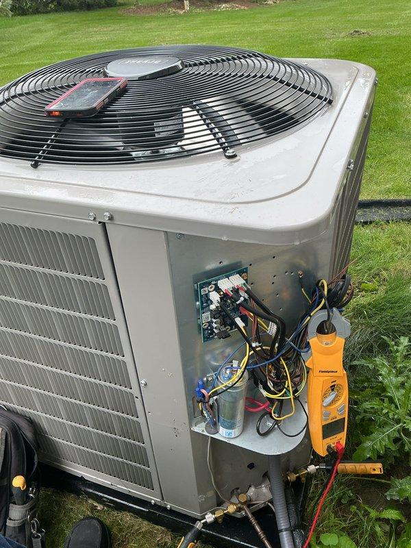 Completed comprehensive tune-up and preventative maintenance on multi-zone HVAC system including air conditioning and gas furnace units. Performed electrical diagnostics using digital multimeter, measuring inrush current at 747.6 amps and verifying proper voltage levels. Inspected condenser unit with access panel open, tested capacitor functionality, examined all electrical connections and wiring harnesses, and attached refrigerant gauges to verify system pressures and refrigerant charge levels. Membership renewal processed and future maintenance appointment scheduled.