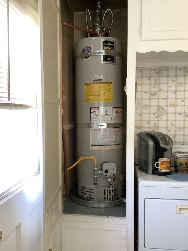 Best Plumber in the area working on Replacing Kenmore Hot water heater Installing New Bradford white 40 gallon Hot Water Heater with all necessary code upgrades 