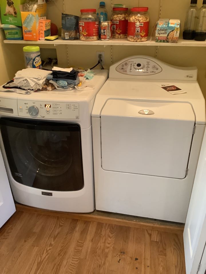 Plumber working on Appliance Hook up after floor was replaced testing for proper operation and verification of no gas or water leaks