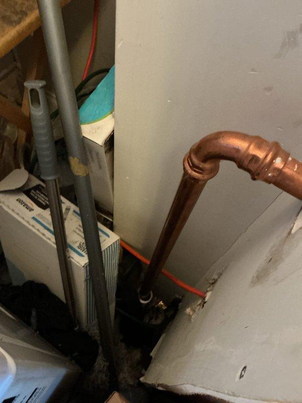 Diagnosed shower's low hot water pressure issue by inspecting plumbing connections. Identified restriction in copper hot water line feeding the shower valve. Cleared mineral buildup in the line and tested water flow, confirming restored pressure to normal operating levels.