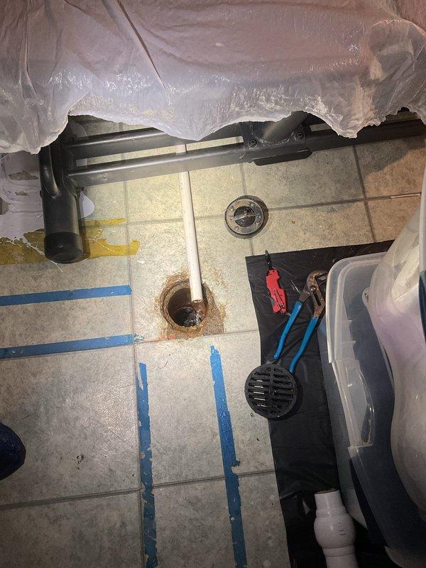 Diagnosed and cleared clogged floor drain in utility room with water heater. Scheduled follow-up service to include pump-out and hydro jetting to ensure complete resolution and prevent future backups.