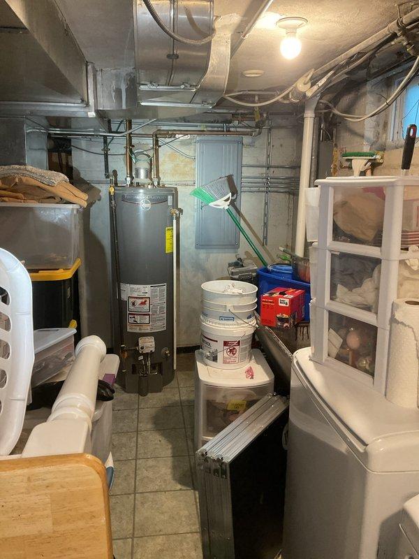 Diagnosed and cleared clogged floor drain in utility room with water heater. Scheduled follow-up service to include pump-out and hydro jetting to ensure complete resolution and prevent future backups.