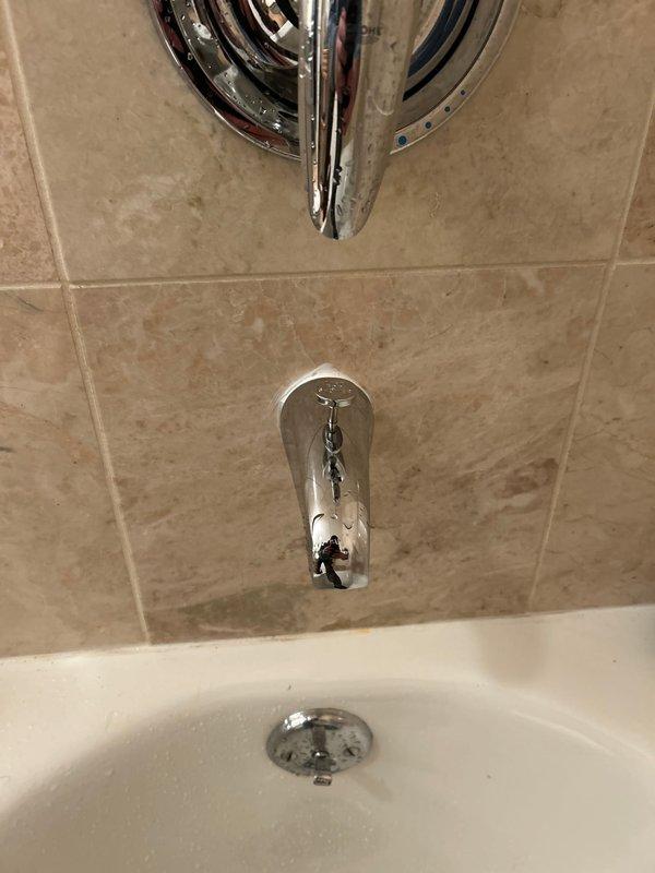 Successfully replaced bathtub spout with identical replacement part sourced from faucet shop as specified. Completed installation on existing chrome fixture setup, ensuring proper fit and function with the surrounding tile work.