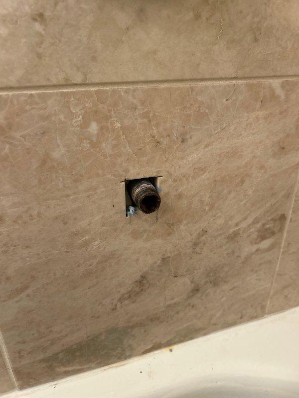Successfully replaced bathtub spout with identical replacement part sourced from faucet shop as specified. Completed installation on existing chrome fixture setup, ensuring proper fit and function with the surrounding tile work.