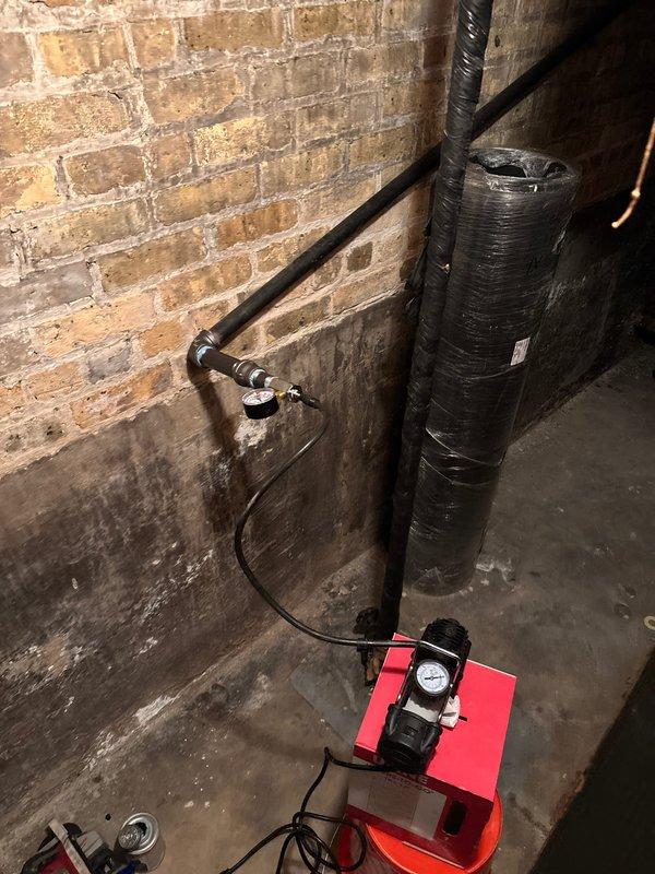 Completed pressure test on gas line system in basement utility area using specialized pressure gauge equipment. Connected testing apparatus to existing piping and monitored for pressure stability. Client was advised of recommended scope of work available for next-day service; customer will confirm decision by 6pm today.