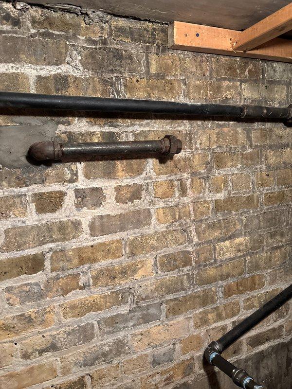 Completed pressure test on gas line system in basement utility area using specialized pressure gauge equipment. Connected testing apparatus to existing piping and monitored for pressure stability. Client was advised of recommended scope of work available for next-day service; customer will confirm decision by 6pm today.