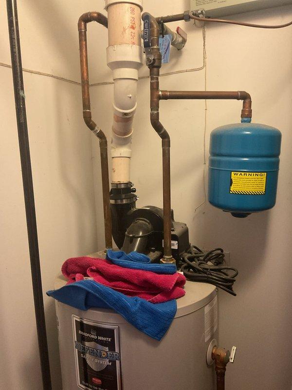 Diagnosed 12-year-old Bradford White gas water heater displaying flammable vapor sensor error code. Identified failed FVS sensor (part #415-45560-00) requiring replacement, with unit serial number NK38404599. Recommended replacement parts have been ordered due to age of unit and sensor failure that occurred after recent flooring installation.