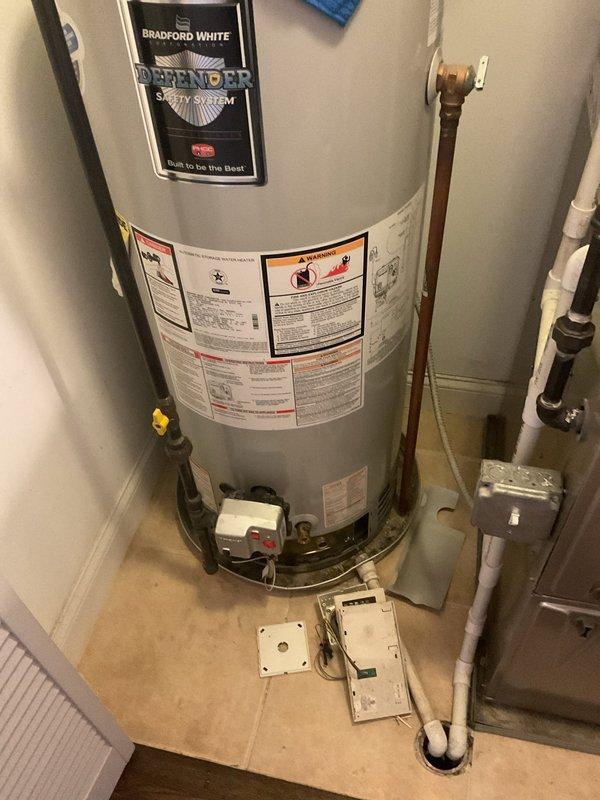Diagnosed 12-year-old Bradford White gas water heater displaying flammable vapor sensor error code. Identified failed FVS sensor (part #415-45560-00) requiring replacement, with unit serial number NK38404599. Recommended replacement parts have been ordered due to age of unit and sensor failure that occurred after recent flooring installation.