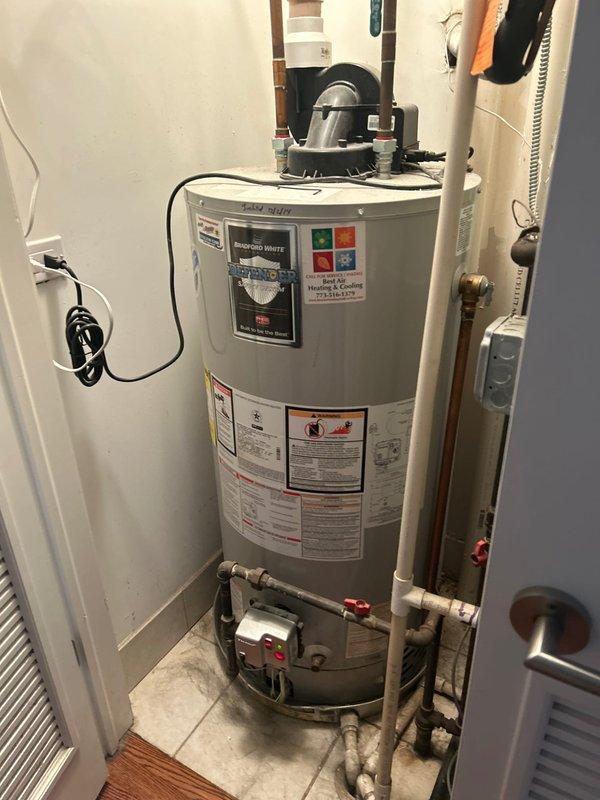 Responded to a rescheduled service call for a bathroom faucet with leaking and stuck cartridge nut issues. Upon inspection, observed corrosion around the drain fixture with visible rust formation. Assessed water heater system for potential connection to faucet pressure problems.