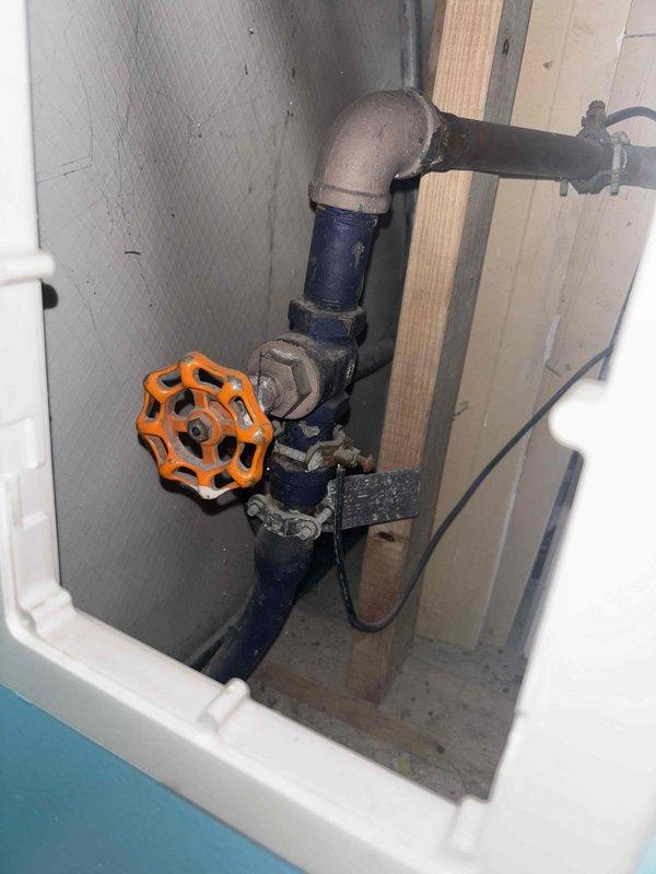 Responded to priority service call regarding toilet not filling properly. Inspected water supply system and accessed shutoff valve assembly in utility space to restore proper water flow. Also evaluated two bathroom sink cartridges for potential replacement as requested by customer Rachel, observing chrome fixtures on marble countertop with subway tile backsplash in good overall condition.