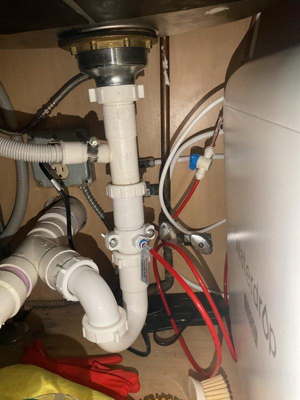 Conducted service call transferred from Jacob. Inspected under-sink plumbing installation including braided supply lines, shut-off valves, and PVC drainage system with P-trap. Verified all components properly installed and functioning with no visible leaks.