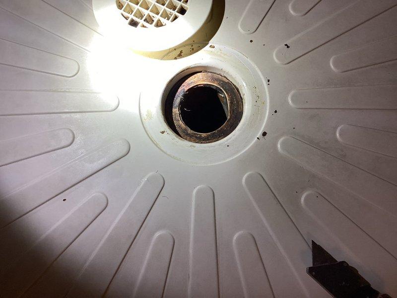 Responded to a water leak issue originating from the unit above. Conducted thorough inspection of the affected bathroom ceiling area showing signs of water infiltration. Located the source of the leak in the upstairs unit's shower drain assembly, which exhibited significant mineral buildup and deterioration around the drain seal. Repaired the faulty drain connection and verified proper drainage function with no further leakage.