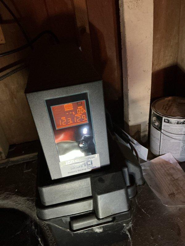 Diagnosed backup sump pump system reporting battery issue; checked controller panel readings and inspected existing battery, which showed signs of deterioration. Replaced backup battery with new unit and verified proper system operation through controller diagnostic test, resolving the recurring alarm condition.
