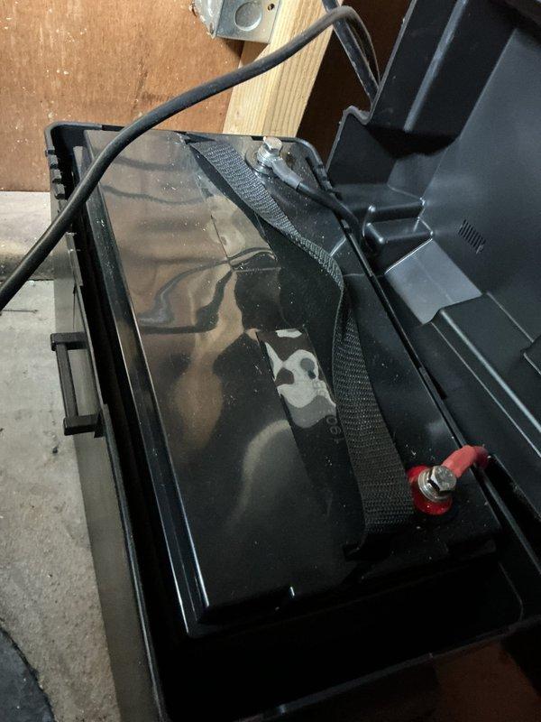 Diagnosed backup sump pump system reporting battery issue; checked controller panel readings and inspected existing battery, which showed signs of deterioration. Replaced backup battery with new unit and verified proper system operation through controller diagnostic test, resolving the recurring alarm condition.